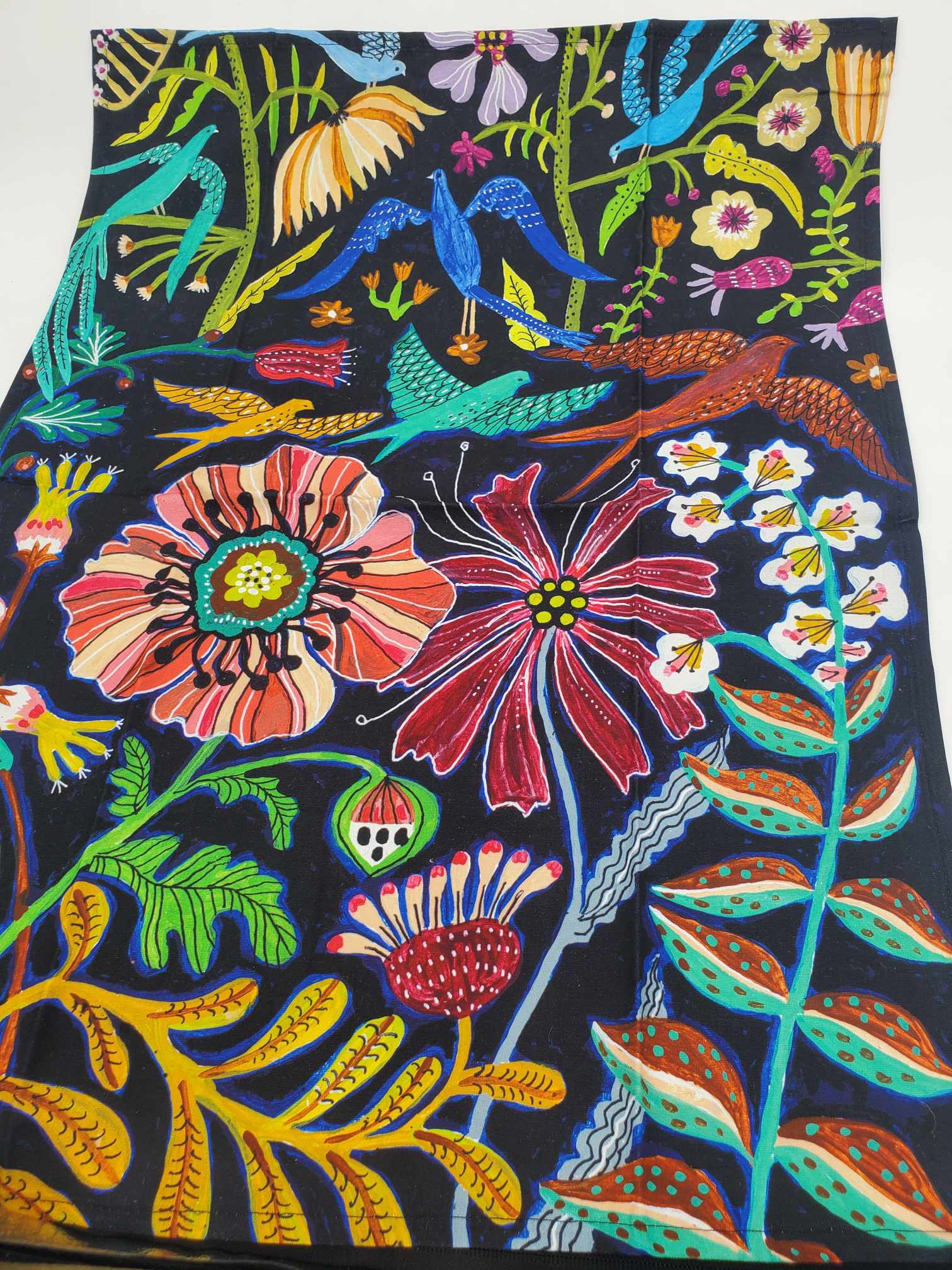 Lori Siebert black oversized tea towel with vibrant tropical print. 